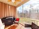 Screened porch with comfortable seating and views of the backyard at 3449 Southern Red Oak Ln, Gastonia, NC 28056