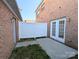 Backyard area with a white privacy fence and patio doors, creating an inviting outdoor space at 3812 York Aly, Lake Park, NC 28079
