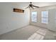 Bedroom featuring neutral carpet, dual windows, and a ceiling fan, perfect for creating a comfortable retreat at 3812 York Aly, Lake Park, NC 28079