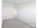 Spacious room with neutral carpet, white walls, and natural light, creating a bright and airy atmosphere at 3812 York Aly, Lake Park, NC 28079