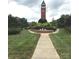 Beautifully landscaped park with clock tower, brick fountain, and manicured green spaces for relaxation at 3812 York Aly, Lake Park, NC 28079