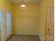 Cozy dining area with a pendant light, tiled floor, and sliding glass door for ample natural light at 3812 York Aly, Lake Park, NC 28079