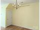 Dining room features a chandelier and is brightly lit; adjacent to a door at 3812 York Aly, Lake Park, NC 28079