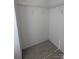 Small walk-in closet featuring carpeted floors and sturdy, coated metal shelving, ready to maximize storage space at 3812 York Aly, Lake Park, NC 28079