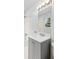 Modern bathroom with gray vanity, bright lighting, and combined shower and tub at 3918 Woodgreen Ter, Charlotte, NC 28205