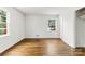Sun-filled bedroom featuring white walls and wood flooring for a warm and inviting atmosphere at 3918 Woodgreen Ter, Charlotte, NC 28205