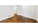 Bedroom features polished wood floors, white walls, and an interior door at 3918 Woodgreen Ter, Charlotte, NC 28205