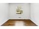Inviting bedroom with wood floors and a bright window, offering a serene and comfortable living space at 3918 Woodgreen Ter, Charlotte, NC 28205
