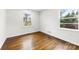 Cozy bedroom with pristine walls and restored hardwood floors showcasing a clean and inviting space at 3918 Woodgreen Ter, Charlotte, NC 28205