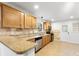 Spacious kitchen featuring stainless steel appliances, granite countertops, and tile flooring at 3918 Woodgreen Ter, Charlotte, NC 28205