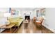Inviting living room with hardwood floors, fireplace, and natural light from a large window at 3918 Woodgreen Ter, Charlotte, NC 28205