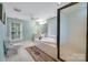 Spacious bathroom features a soaking tub, walk-in shower, and large vanity at 401 W Hoke St, Landis, NC 28088