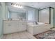Bright bathroom with soaking tub, glass shower, and dual sink vanity at 401 W Hoke St, Landis, NC 28088