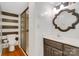 Modern bathroom with a glass-door shower, decorative mirror, and stylish vanity at 401 W Hoke St, Landis, NC 28088
