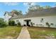 Charming home exterior with well-maintained landscaping and covered entrance at 401 W Hoke St, Landis, NC 28088