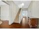 Bright foyer with hardwood floors, staircase, and decorative chandelier at 401 W Hoke St, Landis, NC 28088