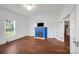 Cozy living room with a blue painted fireplace and hardwood floors at 401 W Hoke St, Landis, NC 28088