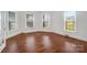 Sun-filled living room featuring hardwood floors and multiple windows at 401 W Hoke St, Landis, NC 28088