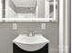 Bathroom with vanity, illuminated mirror, sink and chrome faucet at 428 Chester St, Lancaster, SC 29720