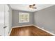 Bedroom featuring hardwood floors, neutral paint, white trim and a window providing natural light at 428 Chester St, Lancaster, SC 29720