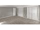 Comfortable bedroom featuring wall-to-wall carpet and three closets for ample storage space at 428 Chester St, Lancaster, SC 29720