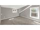 Neutral bedroom with ample natural light, gray walls, and plush carpeting at 428 Chester St, Lancaster, SC 29720