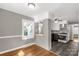 Eat-in kitchen with hardwood floors, a pass-through bar, and views of the adjacent kitchen at 428 Chester St, Lancaster, SC 29720