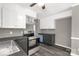 Bright kitchen with stainless steel oven, grey cabinets, grey paneling, and modern appliances at 428 Chester St, Lancaster, SC 29720