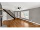 Spacious living room with hardwood floors, staircase, and plenty of natural light at 428 Chester St, Lancaster, SC 29720