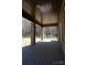 Covered back porch with wooden flooring and brick support columns at 4531 Deer Run None, Rock Hill, SC 29732