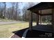 Expansive backyard with lush lawn, landscaping, and covered wooden deck at 4531 Deer Run None, Rock Hill, SC 29732