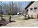 Back exterior of a brick home showing manicured lawn and tasteful landscaping at 4531 Deer Run None, Rock Hill, SC 29732