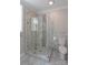 Bathroom featuring glass shower doors, tiled wall, and toilet at 4531 Deer Run None, Rock Hill, SC 29732