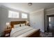 Bedroom featuring a wooden bedframe, two windows, and a double door closet at 4531 Deer Run None, Rock Hill, SC 29732