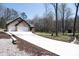 Long driveway leading to a charming brick home featuring an attached two-car garage at 4531 Deer Run None, Rock Hill, SC 29732