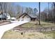 Brick home with a long driveway and a well-manicured lawn at 4531 Deer Run None, Rock Hill, SC 29732
