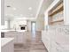 Bright, open kitchen featuring white cabinets, stainless steel appliances, and a decorative backsplash at 4531 Deer Run None, Rock Hill, SC 29732