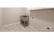 Bright laundry room featuring stainless steel utility sink and marble flooring at 4531 Deer Run None, Rock Hill, SC 29732
