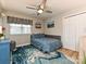 Cozy bedroom with natural light, ceiling fan, and decorative rug at 5091 Windward Dr, Tega Cay, SC 29708