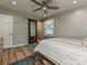 Bedroom featuring a ceiling fan, a sliding door and an area rug at 5091 Windward Dr, Tega Cay, SC 29708