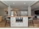 Kitchen island with built-in microwave, a butcher block countertop, and seating for casual dining at 5091 Windward Dr, Tega Cay, SC 29708