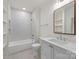 Modern bathroom featuring a tub-shower combination, tile flooring, and a vanity with storage at 5124 Lansing Dr, Charlotte, NC 28270