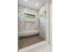 Contemporary marble tiled shower with a built-in bench and glass enclosure at 5124 Lansing Dr, Charlotte, NC 28270