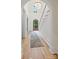 Grand foyer with staircase, arched entryway, wooden front door, and decorative chandelier at 5124 Lansing Dr, Charlotte, NC 28270