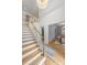 Bright foyer with hardwood staircase, high ceilings, and views into the dining room at 5124 Lansing Dr, Charlotte, NC 28270