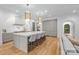 Gourmet kitchen featuring a long center island with seating and stainless appliances, perfect for entertaining at 5124 Lansing Dr, Charlotte, NC 28270