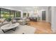 Open concept living room connects seamlessly to a well-appointed kitchen with an island and barstool seating at 5124 Lansing Dr, Charlotte, NC 28270