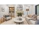 Cozy living room features a stone fireplace, built-in shelving, and neutral-toned furnishings at 5124 Lansing Dr, Charlotte, NC 28270