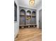 Custom mudroom area with built-in storage lockers, wood benches, and stylish design for organization at 5124 Lansing Dr, Charlotte, NC 28270