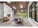 Relaxing screened patio with stone floor, outdoor fireplace, and backyard view at 5124 Lansing Dr, Charlotte, NC 28270